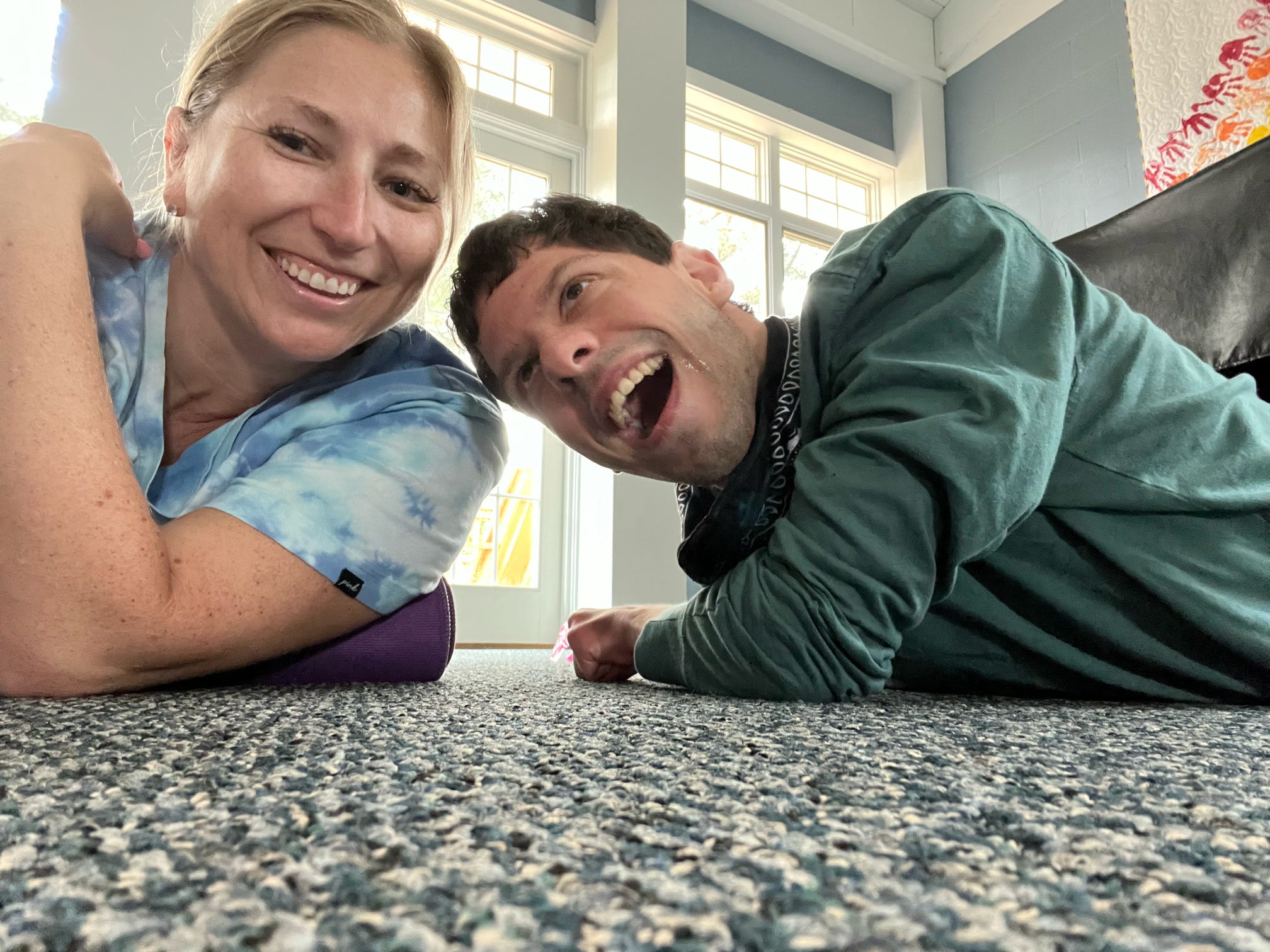 Counselor and camper enjoying stretching after breakfast.